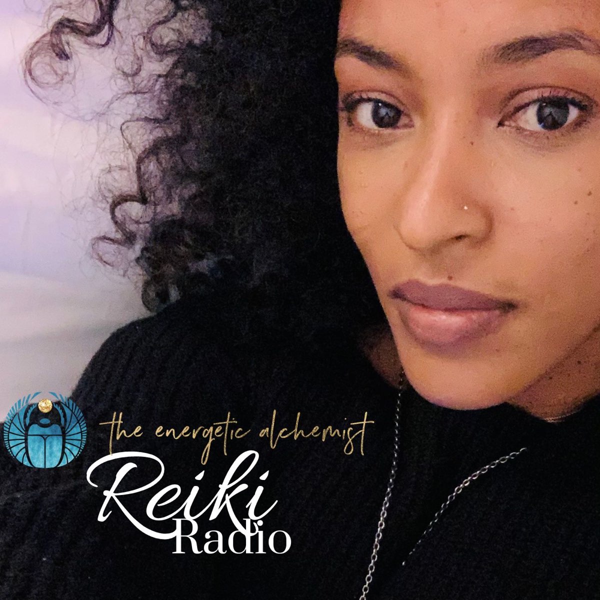 Close-up portrait of a woman with natural curly hair and a calm, direct gaze, shown from the shoulders up against a softly lit background. A circular blue emblem appears in the lower left corner, alongside the text “the energetic alchemist” and “Reiki Radio” in decorative lettering.